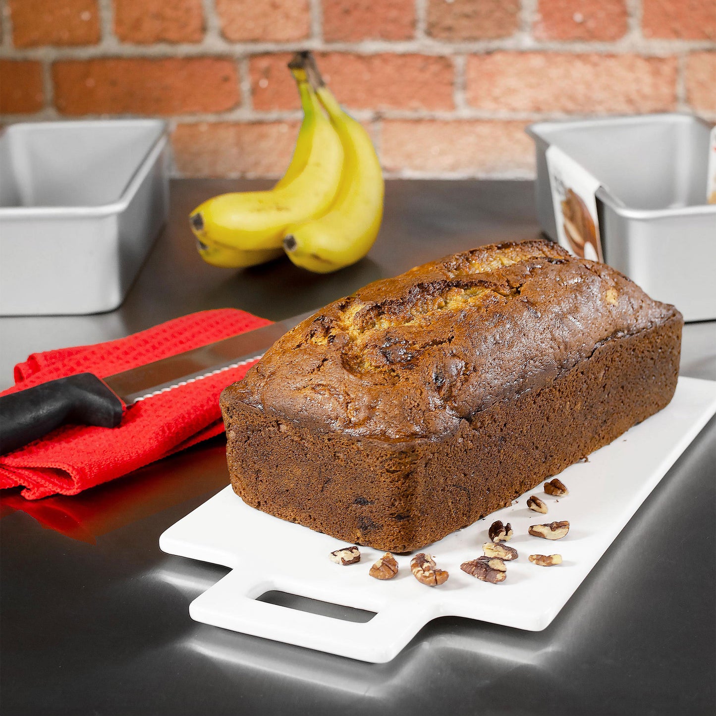 Bread loaf pan with banana bread in a kitchen