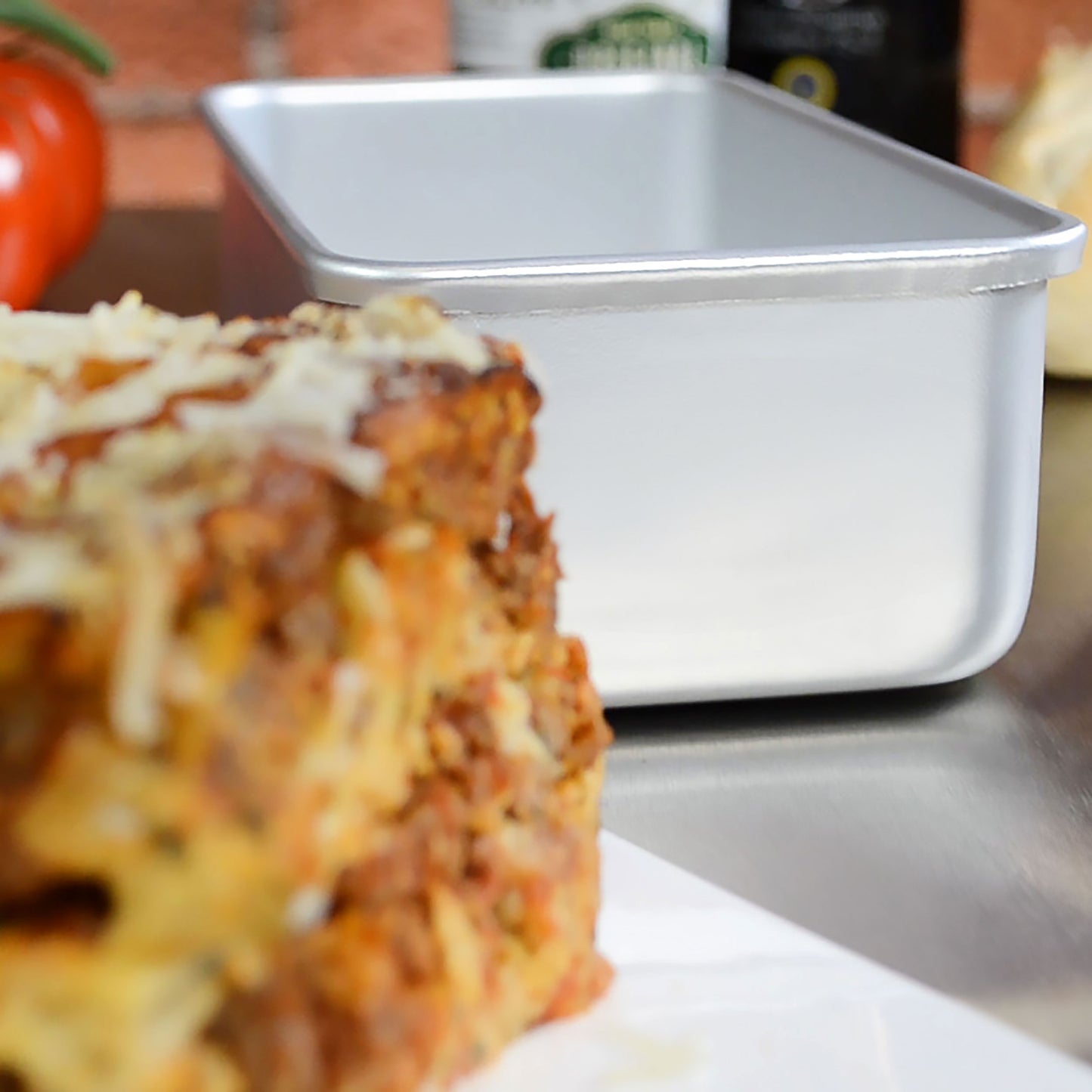 Bread loaf pan and lasagna in a restaurant kitchen