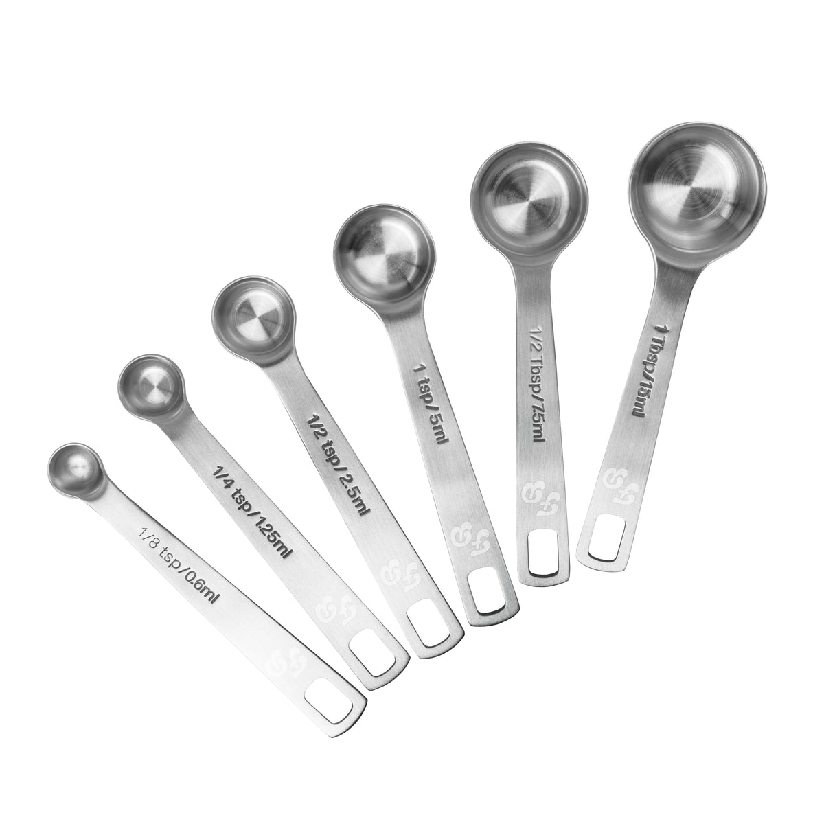 Stainless steel Fat Daddio’s measuring cups and spoons set arranged on a kitchen countertop