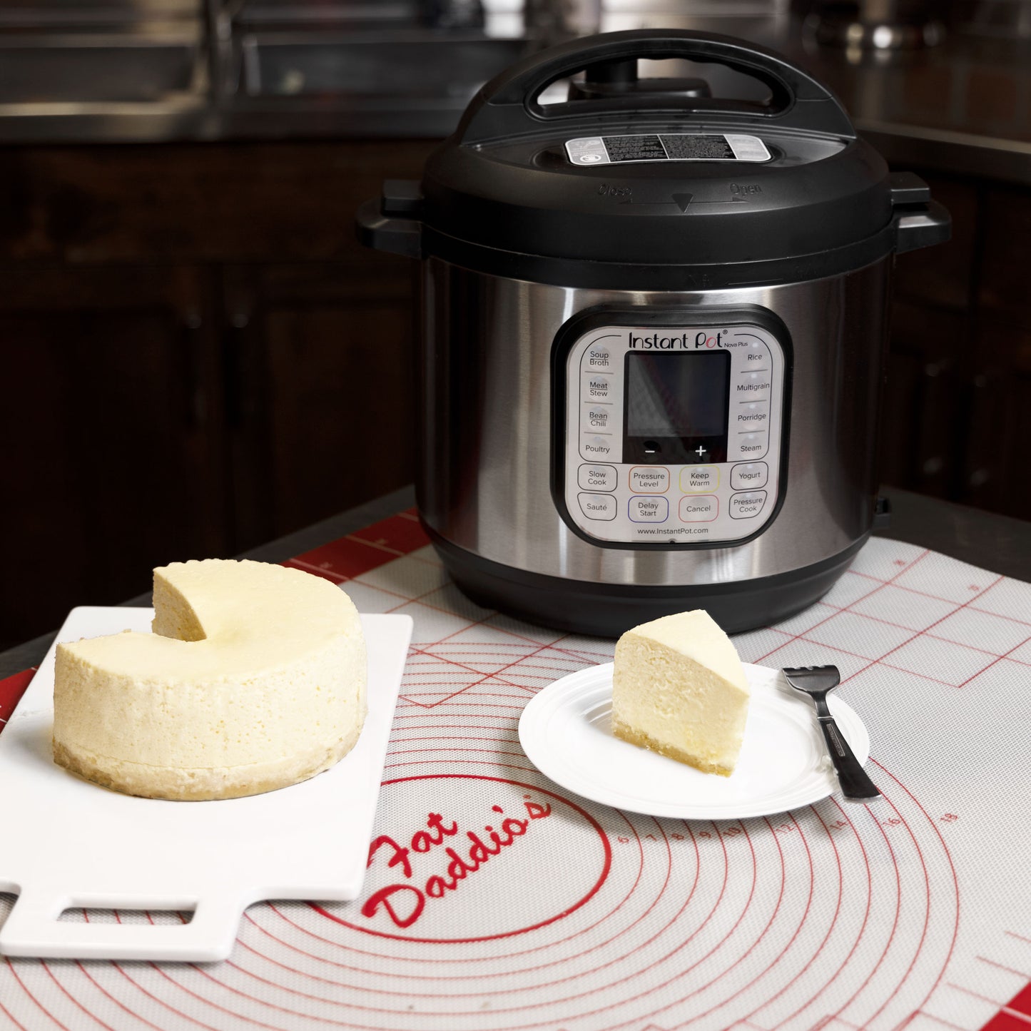 An PIP Instant Pot, New York style cheesecake and plated cheesecake on a baking mat