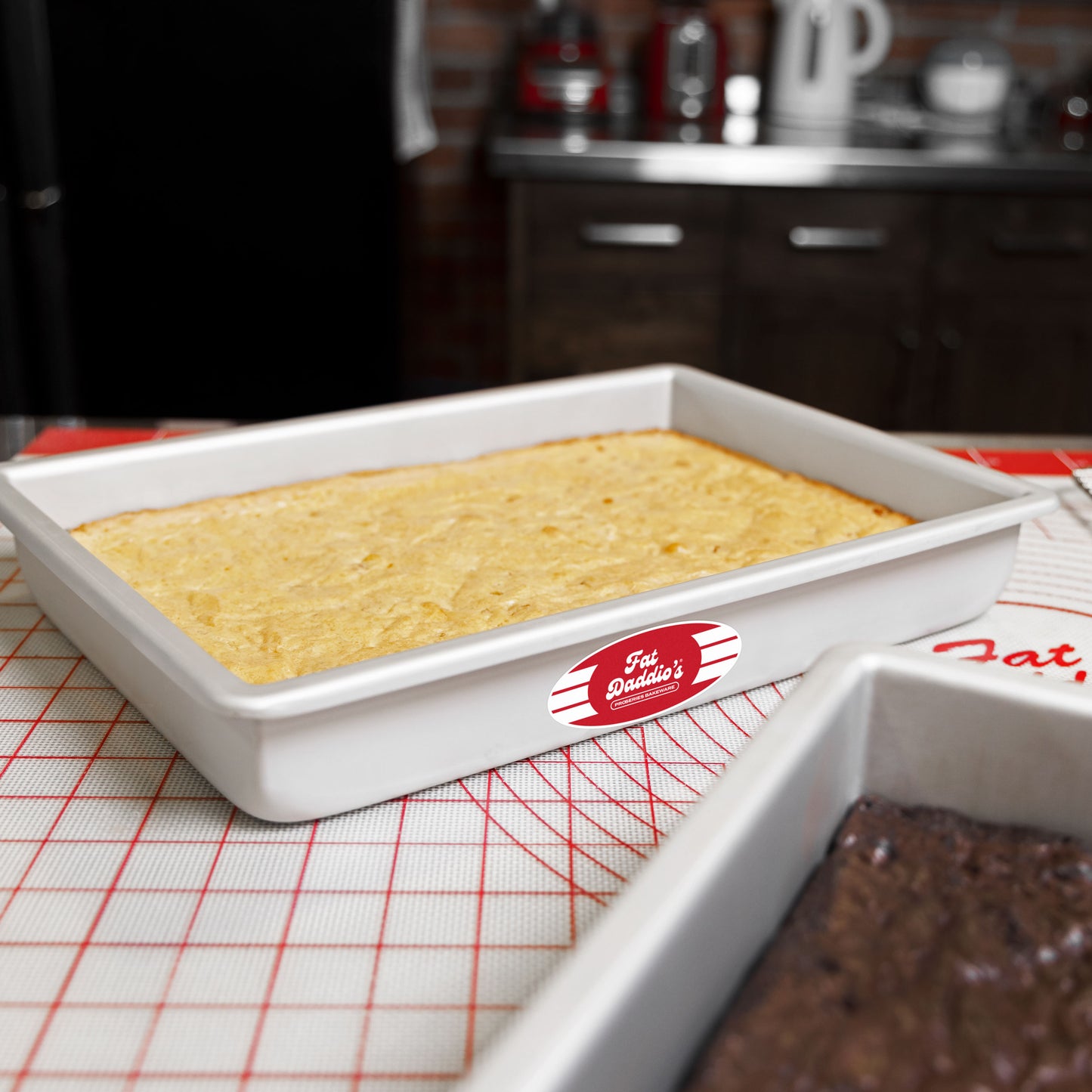 Rectangle sheet cake pan with a blondie and a brownie in a bakery